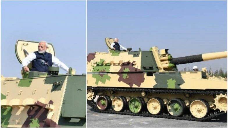 K-9 Howitzer तोफेमधून सफर करताना पंतप्रधान नरेंद्र मोदी (Video) K-9 Howitzer तोफेमधून सफर करताना पंतप्रधान नरेंद्र मोदी (Video)
