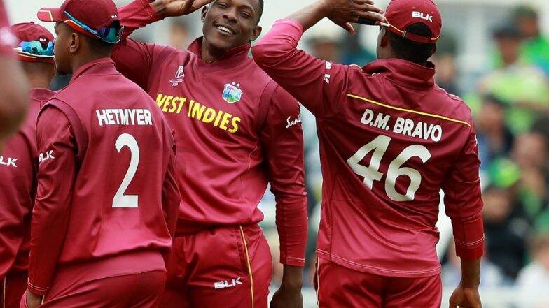ICC World Cup 2019: शेल्डन कॉट्रेल च्या छोट्या चाहत्यांनी केले त्याच्या मिलिट्री स्टाइल सैल्यूट चे अनुकरण; खुश होऊन दिले IND vs WI मॅच बघण्याचे आमंत्रण ICC World Cup 2019: शेल्डन कॉट्रेल च्या छोट्या चाहत्यांनी केले त्याच्या मिलिट्री स्टाइल सैल्यूट चे अनुकरण; खुश होऊन दिले IND vs WI मॅच बघण्याचे आमंत्रण