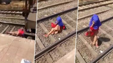 Shocking! अंगावरून ट्रेन जात असतानाही फोनवर बोलत राहिली महिला; पहा अंगावर काटा आणणारा व्हिडीओ (Watch)