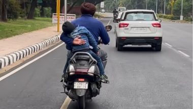 Shocking & Dangerous Driving Videos: एका हातात बाळ, दुसऱ्या हातात बाईकचे हँडल; धोकादायक स्थितीत Scooter चालवणाऱ्या इसमाचा व्हिडिओ व्हायरल