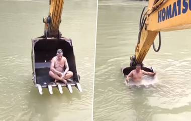 Man Bath In JCB: इंजिनीअरनं थेट जेसीबीत बसून केली नदीत आंघोळ, व्हिडिओ व्हायरल