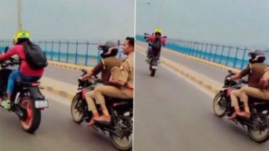 Stunt Viral Video : पोलिसांसमोरच स्टंटबाजी, पुढचं चाक उचलून बाईक पळवली, व्हिडिओ व्हायरल झाल्यानंतर तरूणावर कारवाई